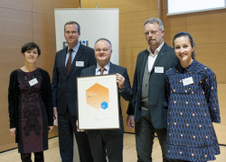 APATEQ CEO Bogdan Serban and team with the Fedil Innovation Award certificate s
